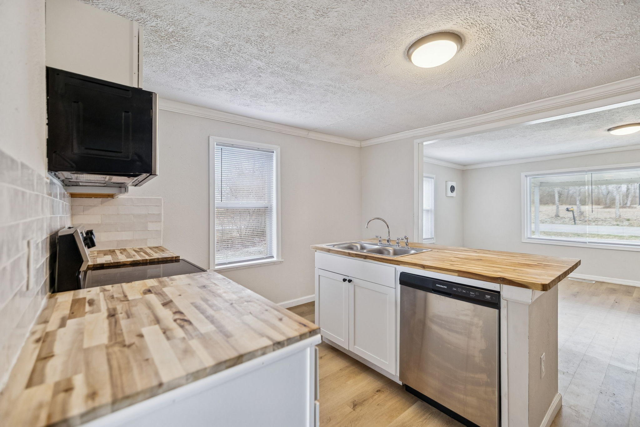 396 Pomona Road Crossville, TN 38571 - Photo 7 of 17 a kitchen with a sink and a stove top oven