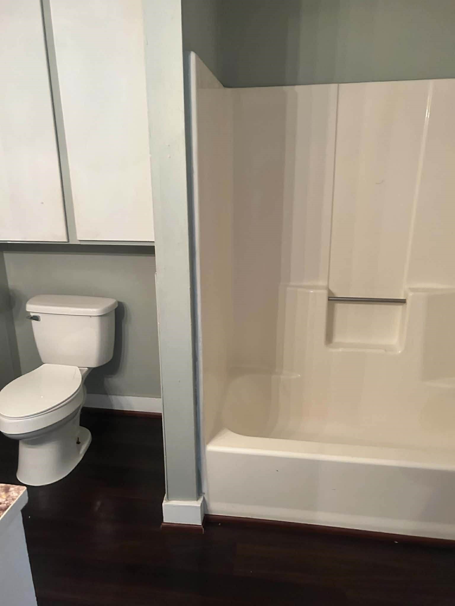 11 Smith Street Shepherd, TX 77371 - Photo 27 of 31 a bathroom with a toilet a sink and bathtub