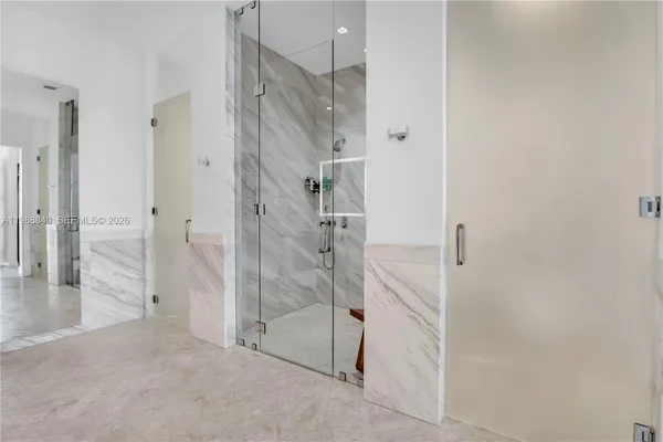 a bedroom with a bed painting and a potted plant