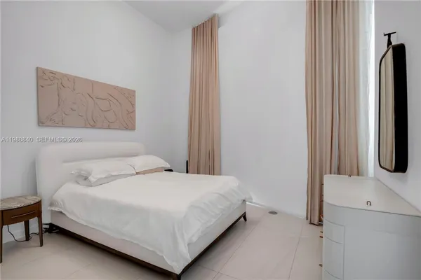 a bathroom with a toilet sink vanity and mirror