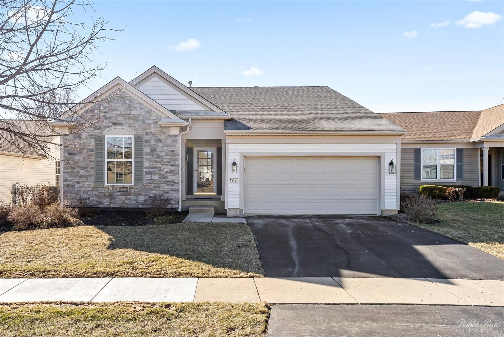 13431 Crestview Drive Huntley, IL 60142 - Photo 1 of 39 a front view of a house with a yard and garage