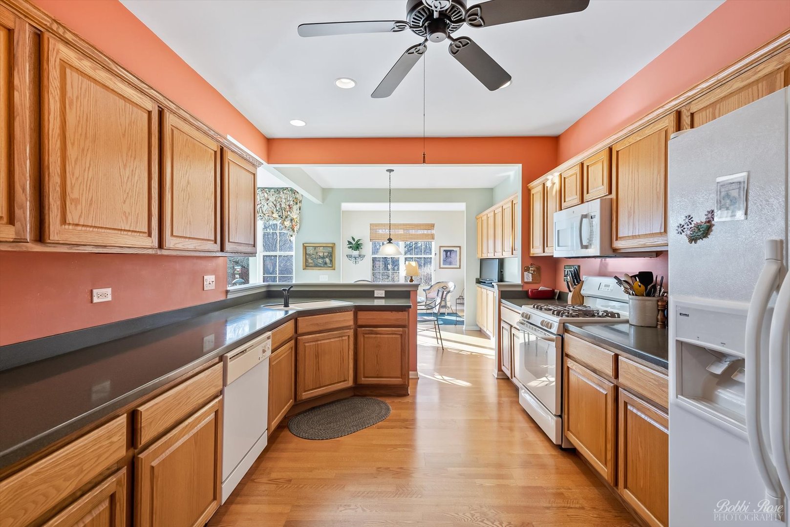 13431 Crestview Drive Huntley, IL 60142 - Photo 11 of 39 a kitchen with stainless steel appliances granite countertop a sink and wooden cabinets