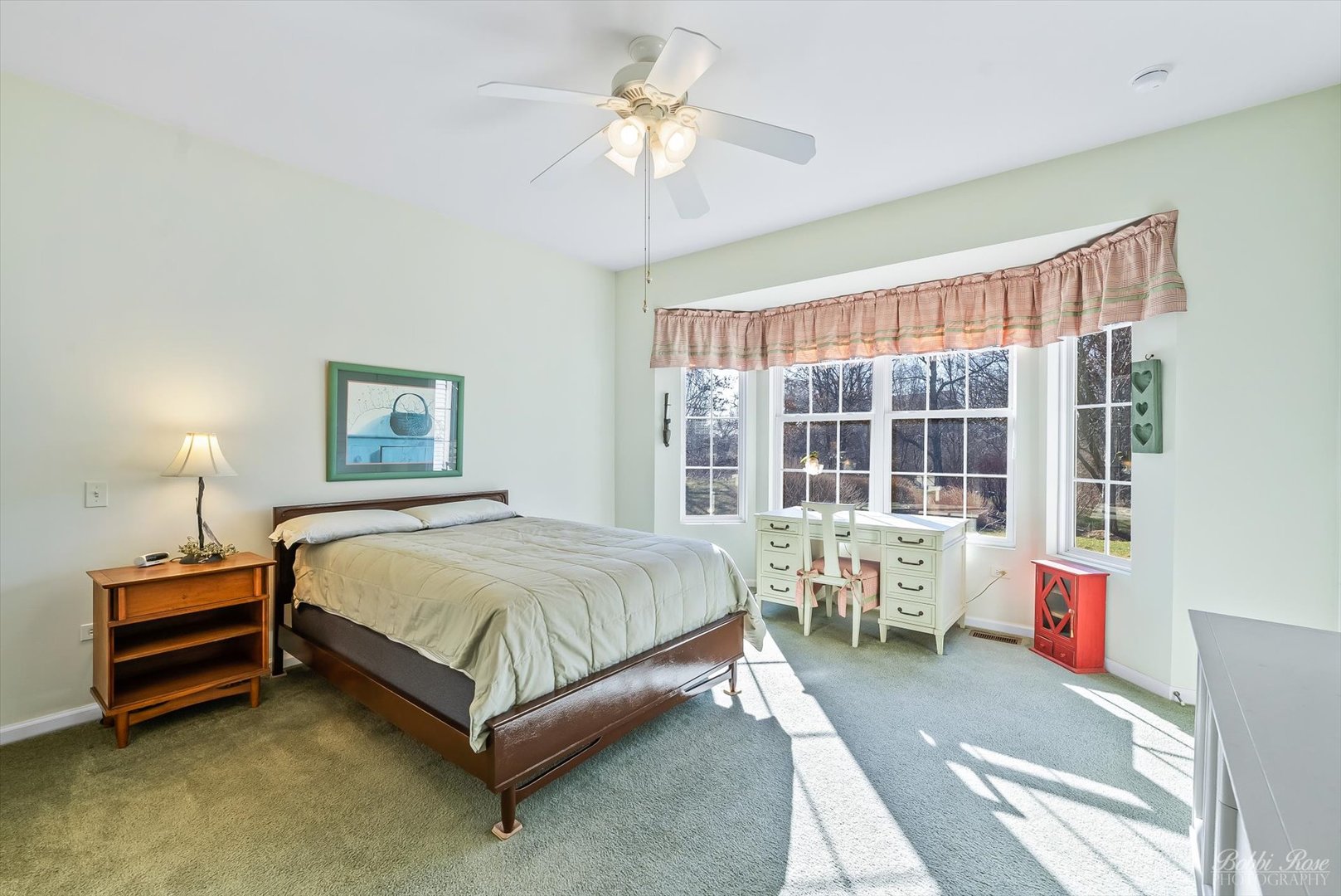 13431 Crestview Drive Huntley, IL 60142 - Photo 18 of 39 a bedroom with a bed and a chandelier