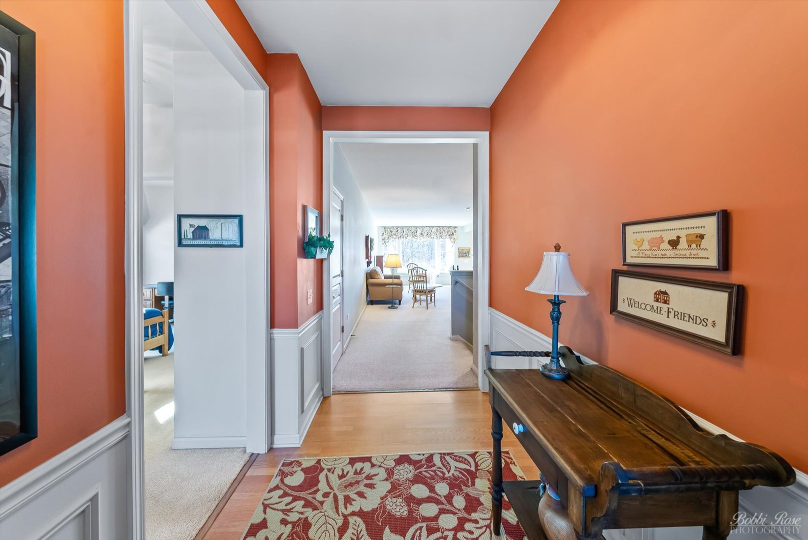 13431 Crestview Drive Huntley, IL 60142 - Photo 4 of 39 a view of a hallway with a couch and dining table