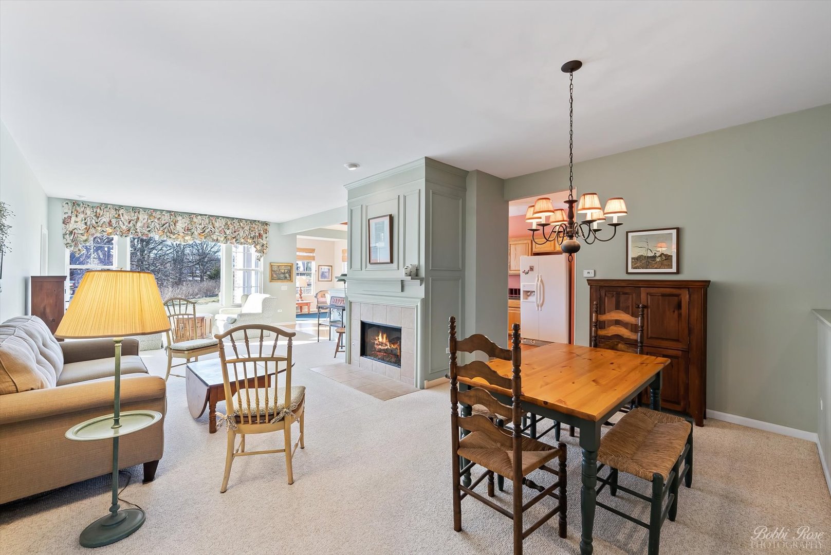 13431 Crestview Drive Huntley, IL 60142 - Photo 7 of 39 a dining room with furniture a chandelier and wooden floor