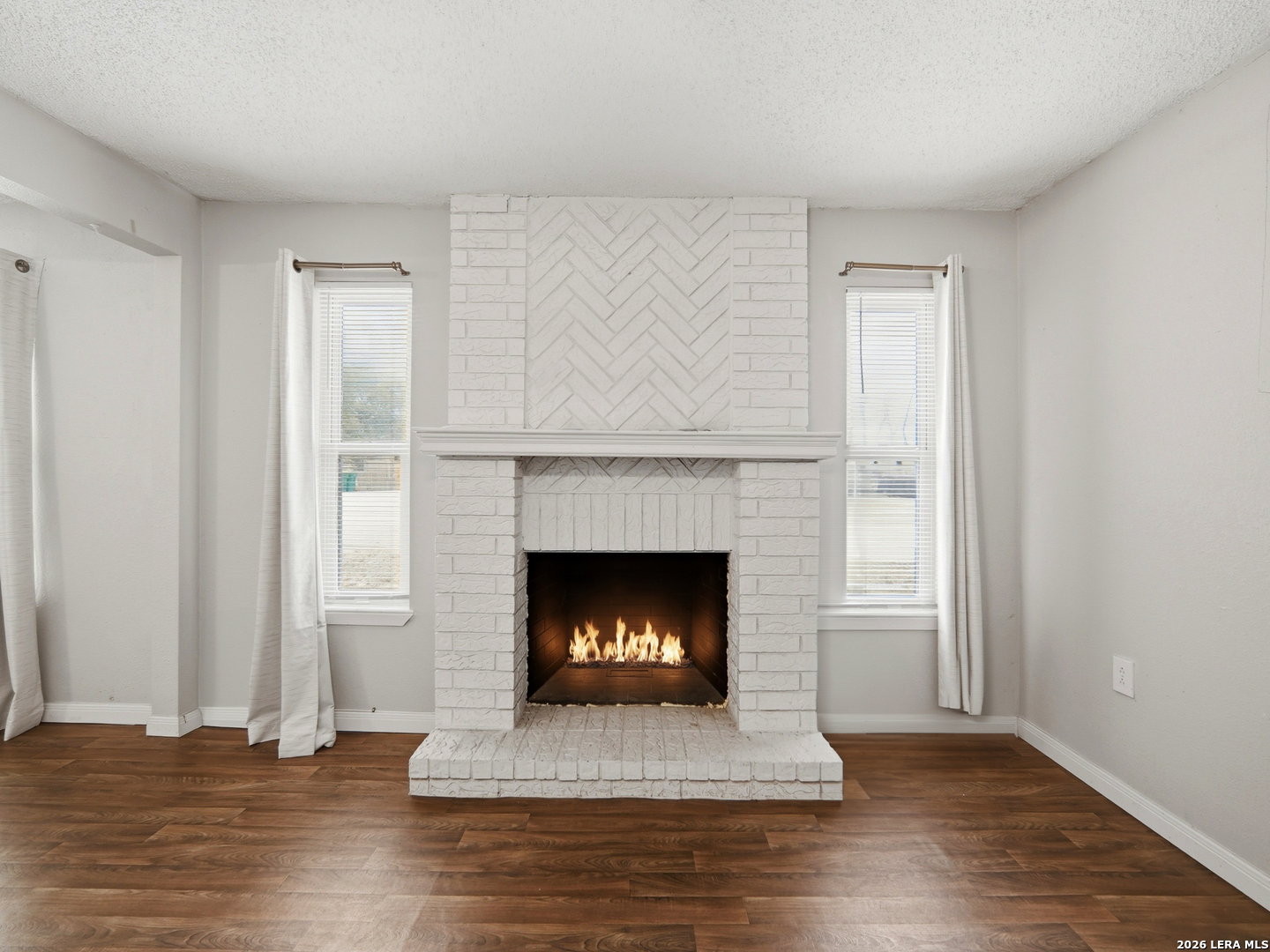 a living room with a fireplace