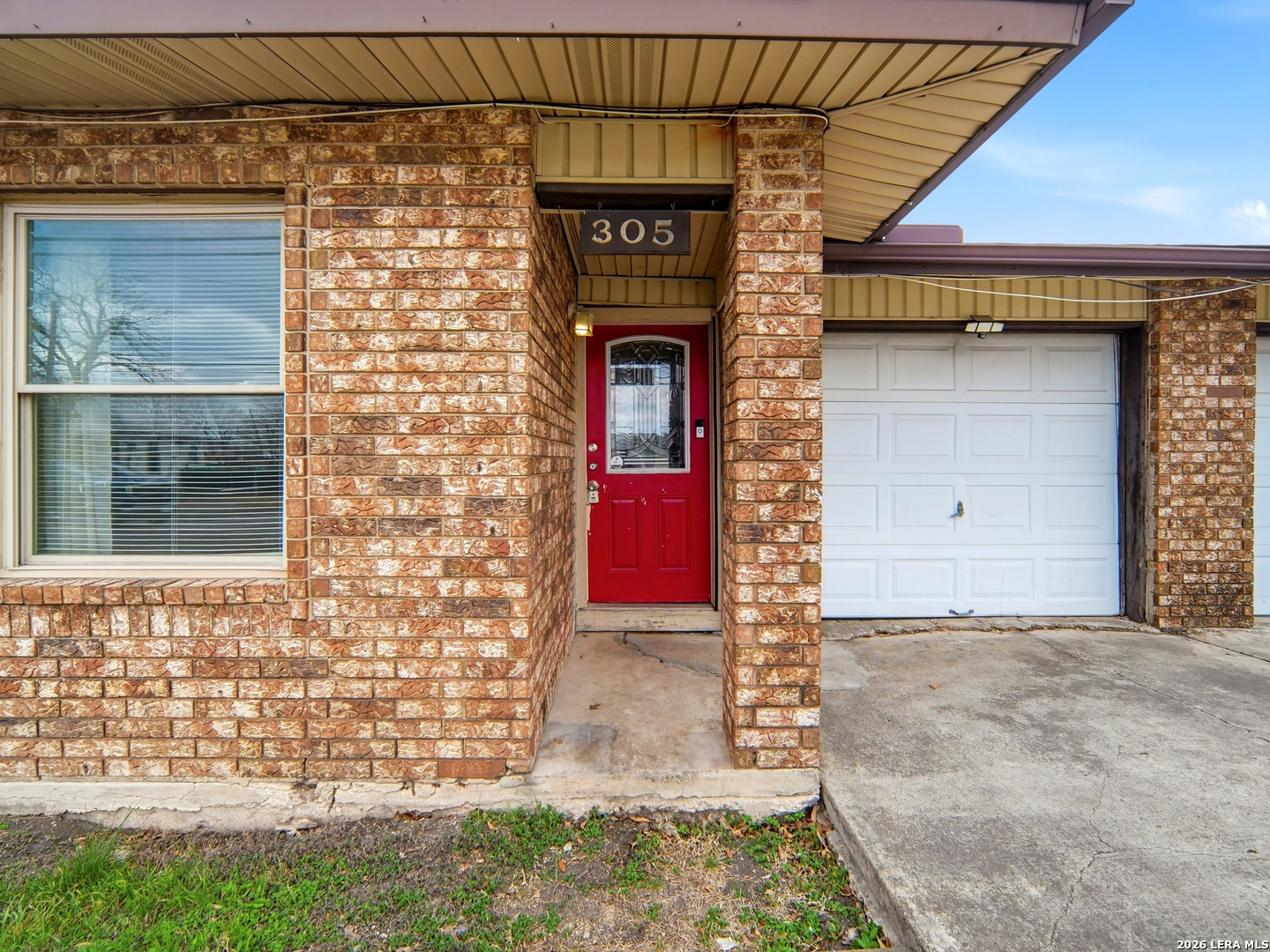 305 Toepperwein Road Converse, TX 78109 - Photo 12 of 25 a view of a brick house with a large door