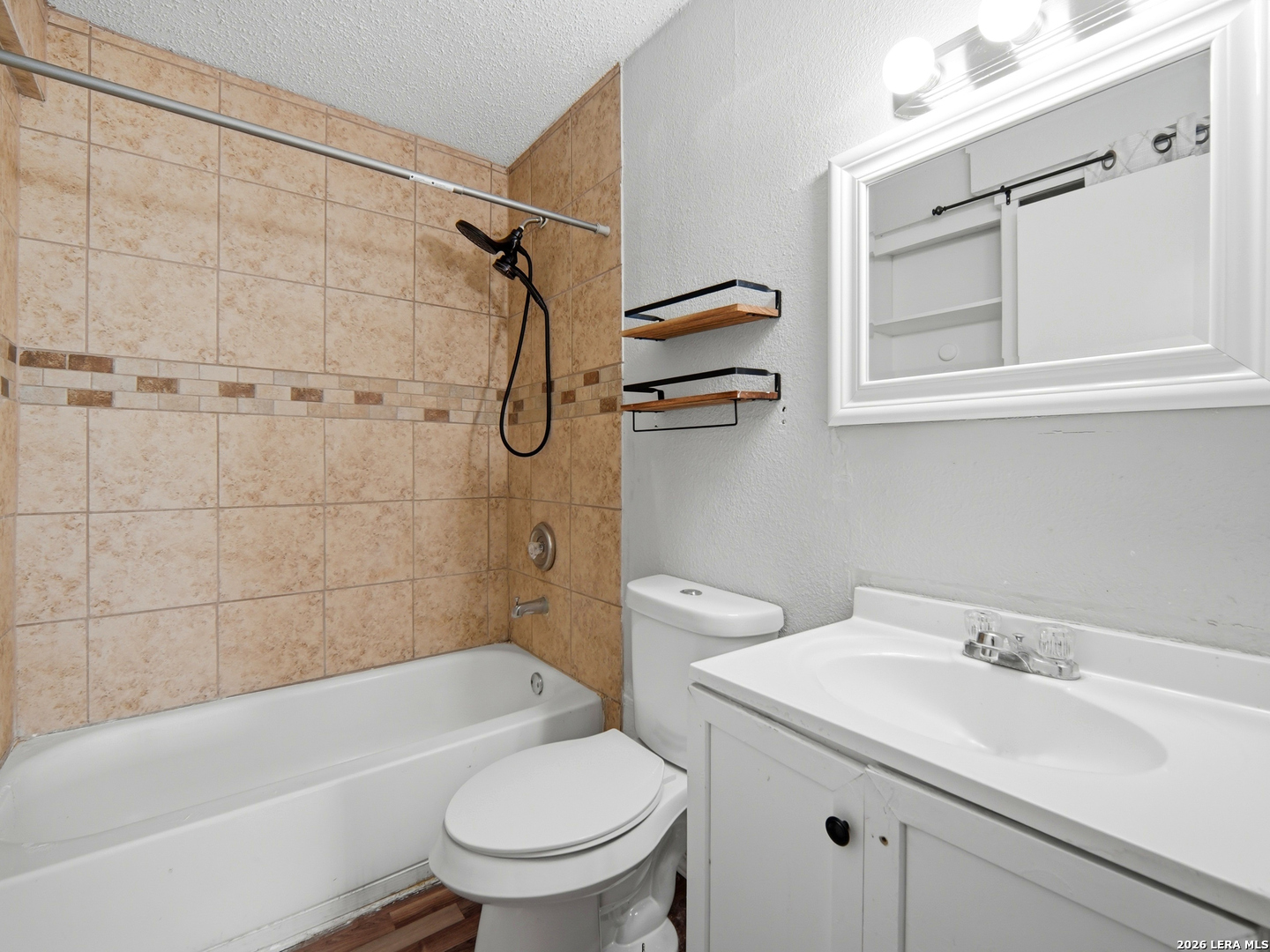 305 Toepperwein Road Converse, TX 78109 - Photo 16 of 25 a bathroom with a sink toilet and shower
