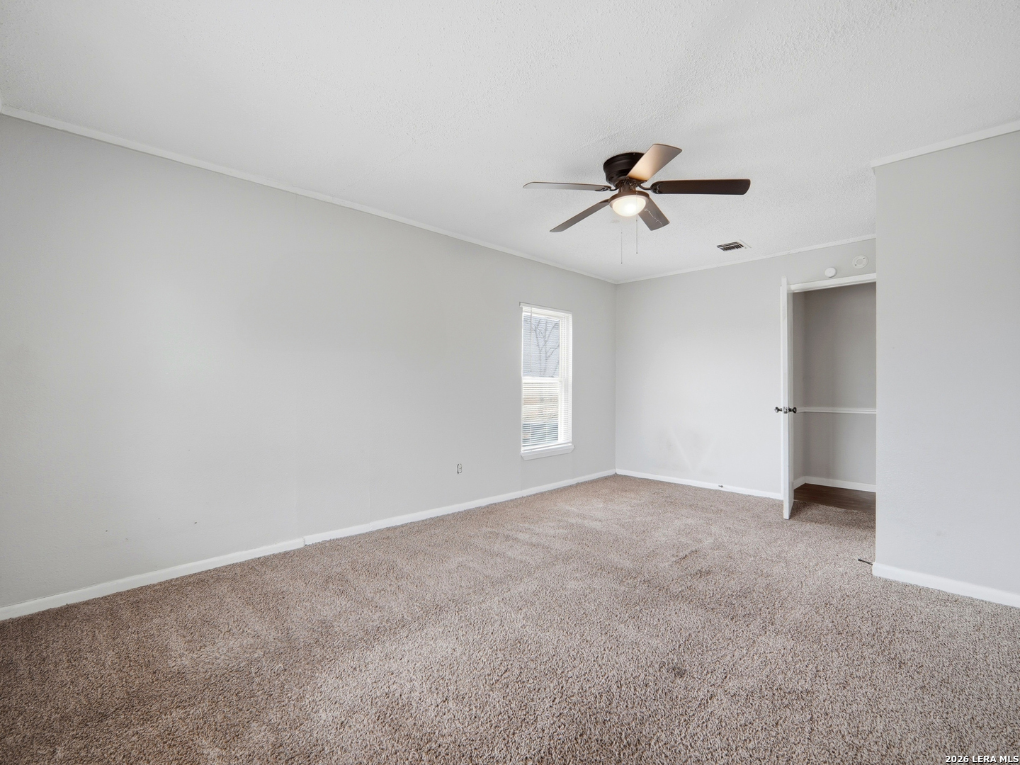 305 Toepperwein Road Converse, TX 78109 - Photo 17 of 25 an empty room with fan and windows