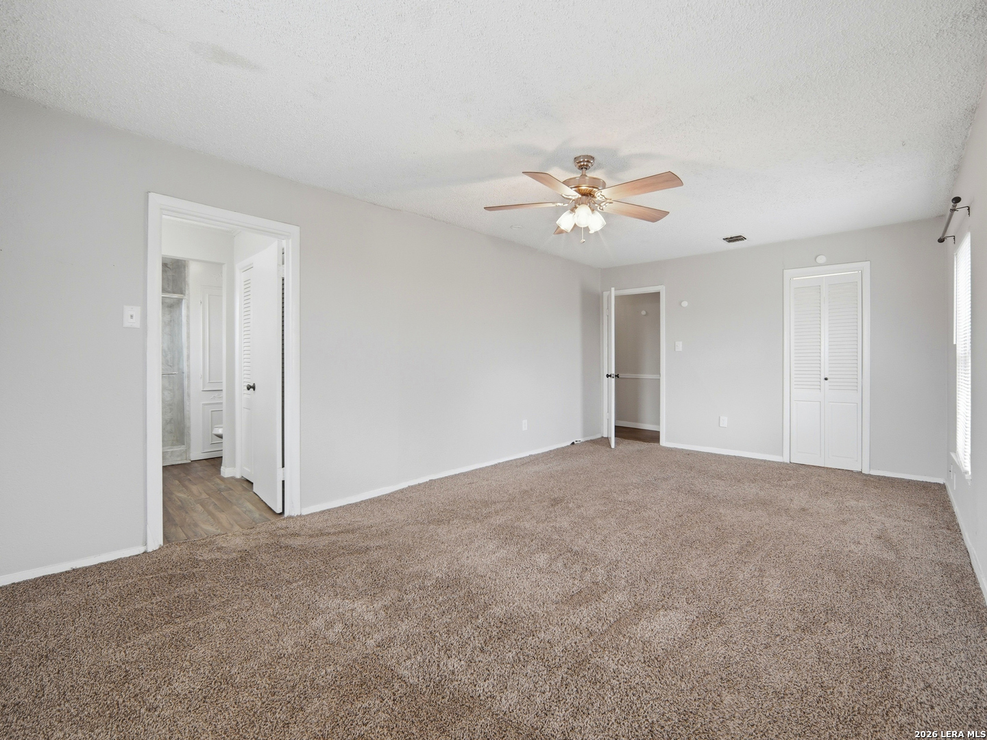 305 Toepperwein Road Converse, TX 78109 - Photo 19 of 25 a view of an empty room with a ceiling fan