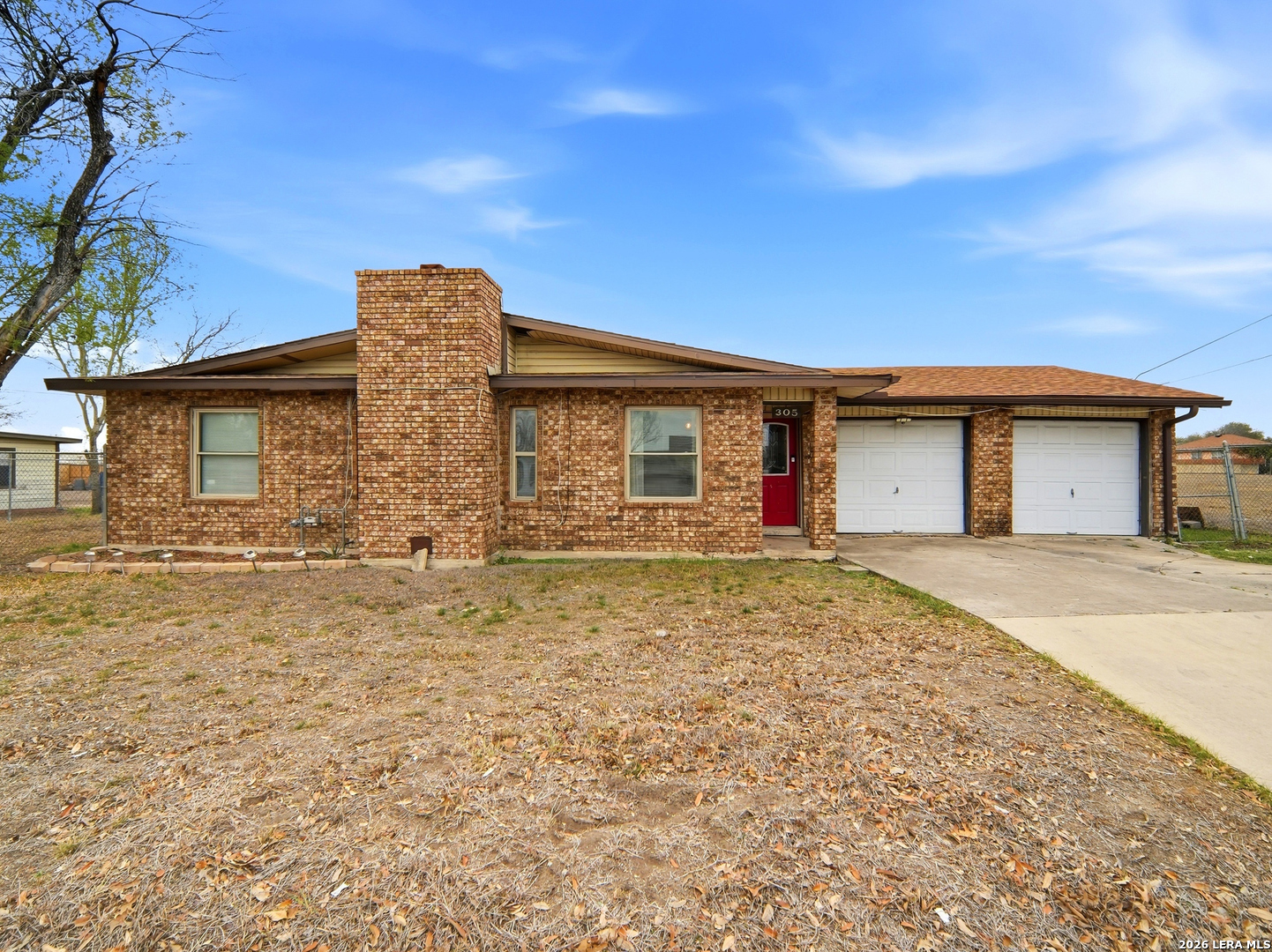 305 Toepperwein Road Converse, TX 78109 - Photo 21 of 25 a front view of a house with a garden