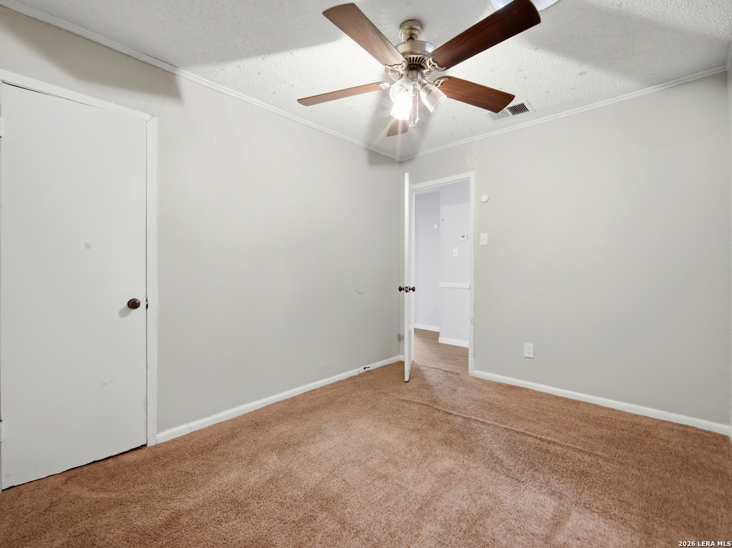 305 Toepperwein Road Converse, TX 78109 - Photo 23 of 25 an empty room with a fan
