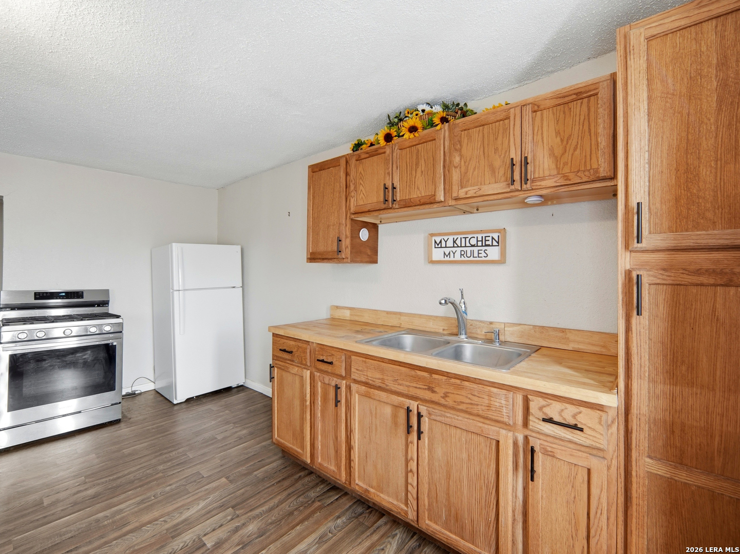 305 Toepperwein Road Converse, TX 78109 - Photo 24 of 25 a kitchen with stainless steel appliances granite countertop a sink and cabinets