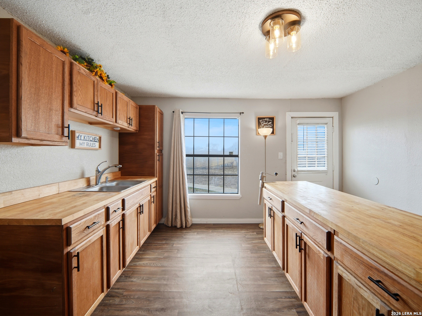 305 Toepperwein Road Converse, TX 78109 - Photo 3 of 25 a kitchen with stainless steel appliances granite countertop a stove and a sink