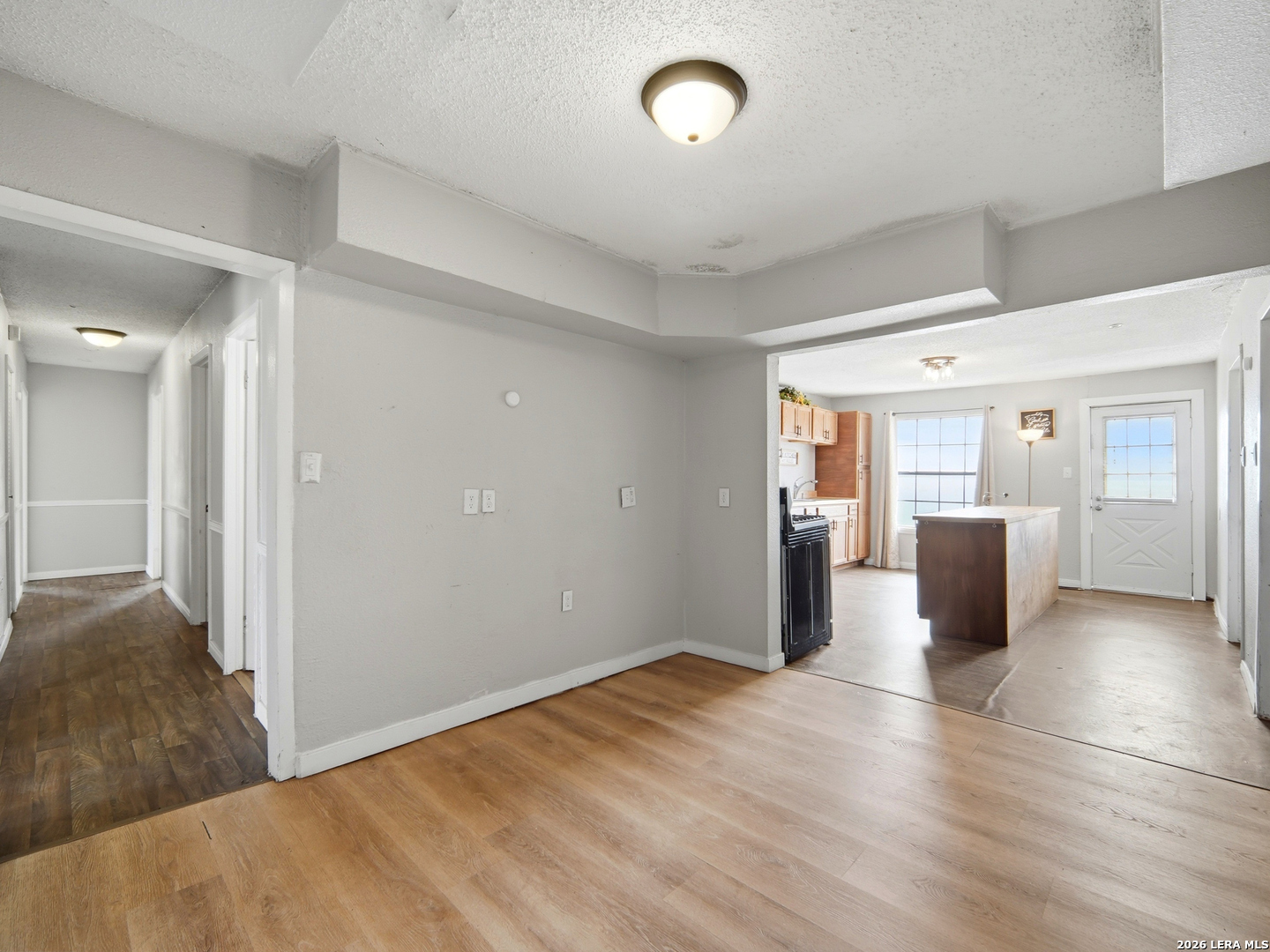 305 Toepperwein Road Converse, TX 78109 - Photo 9 of 25 a view of a big room with wooden floor and windows