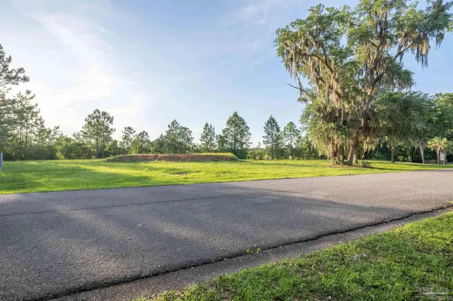 a view of a swimming pool and a yard