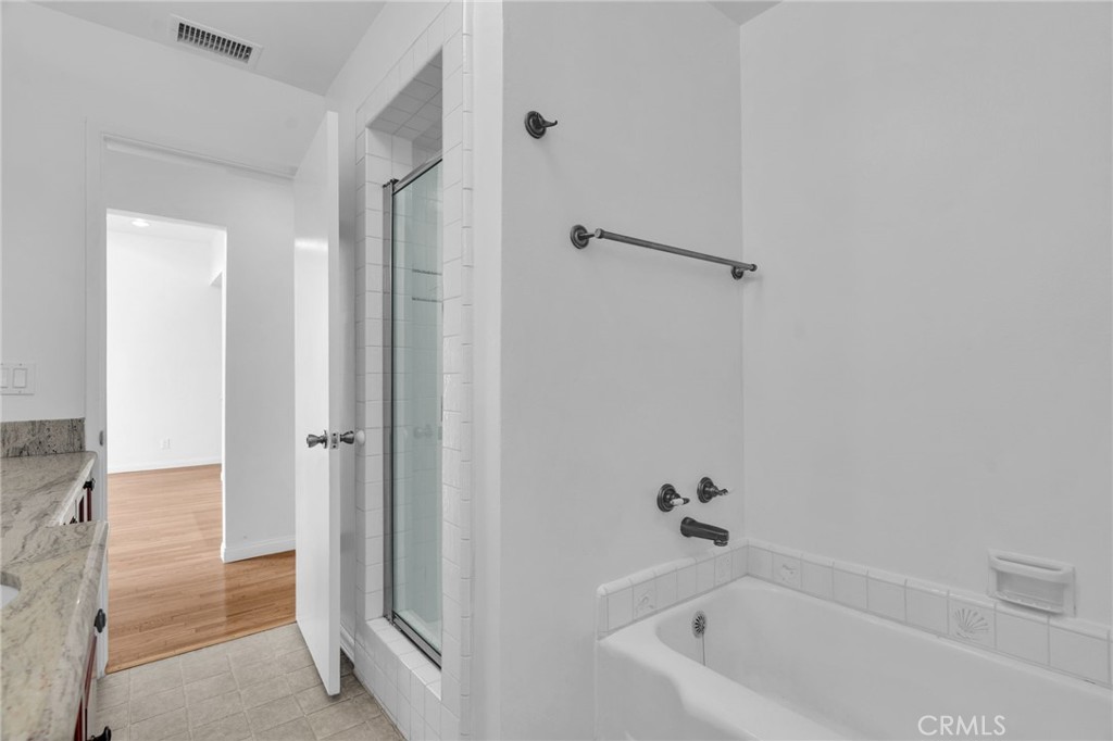 4114 Artesia Boulevard Torrance, CA 90504 - Photo 16 of 21 a bathroom with a bathtub