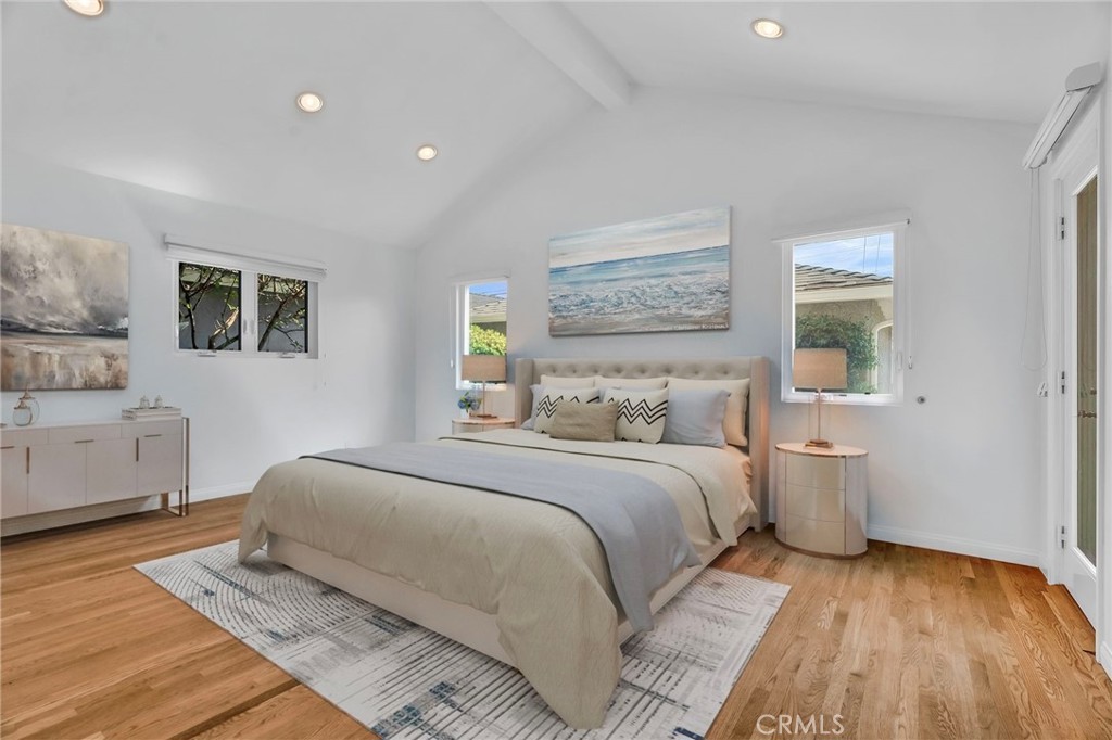 4114 Artesia Boulevard Torrance, CA 90504 - Photo 2 of 21 a bedroom with a large bed and a wooden floor