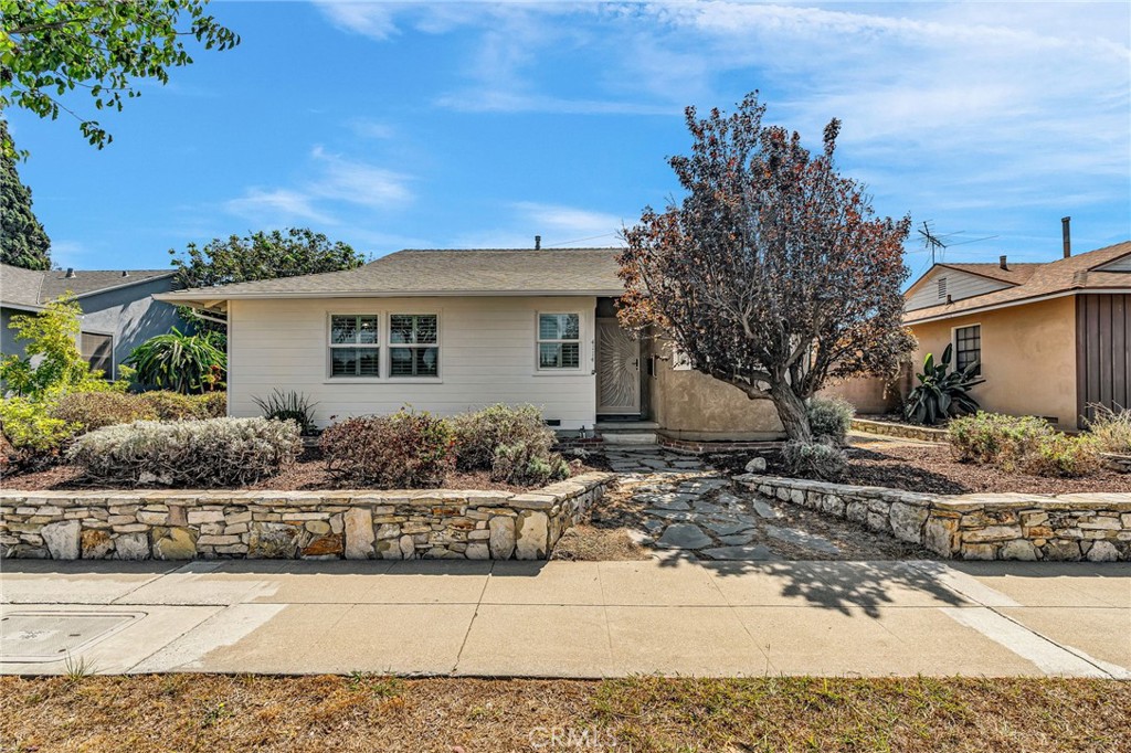 4114 Artesia Boulevard Torrance, CA 90504 - Photo 3 of 21 a front view of a house with a yard