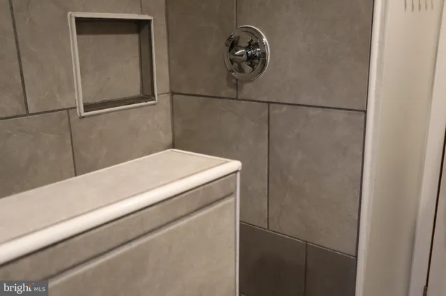 a bed sitting in a bedroom and closet