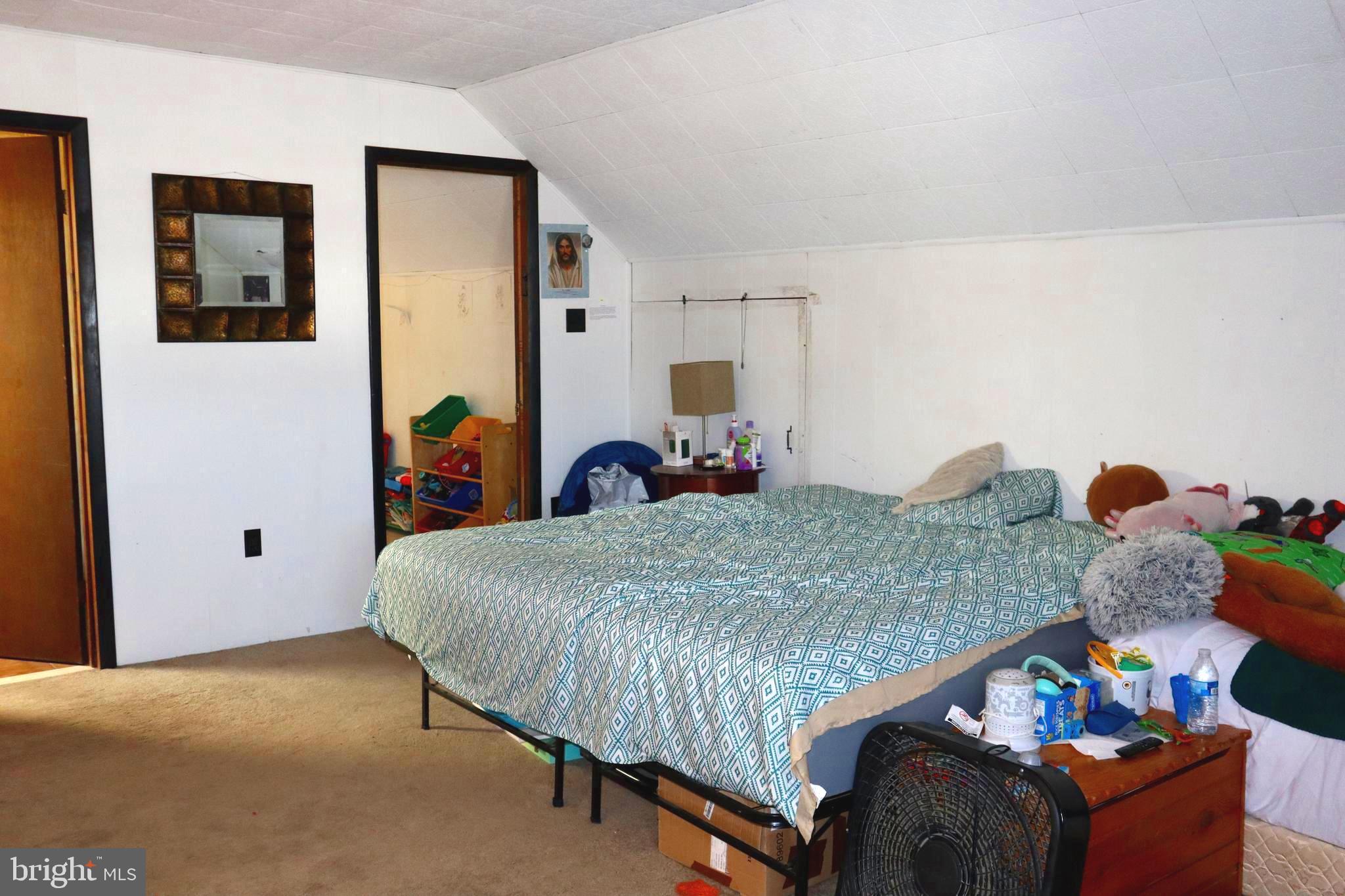 121 Patterson Avenue Bellmawr, NJ 08031 - Photo 13 of 20 a bedroom with a bed and dresser