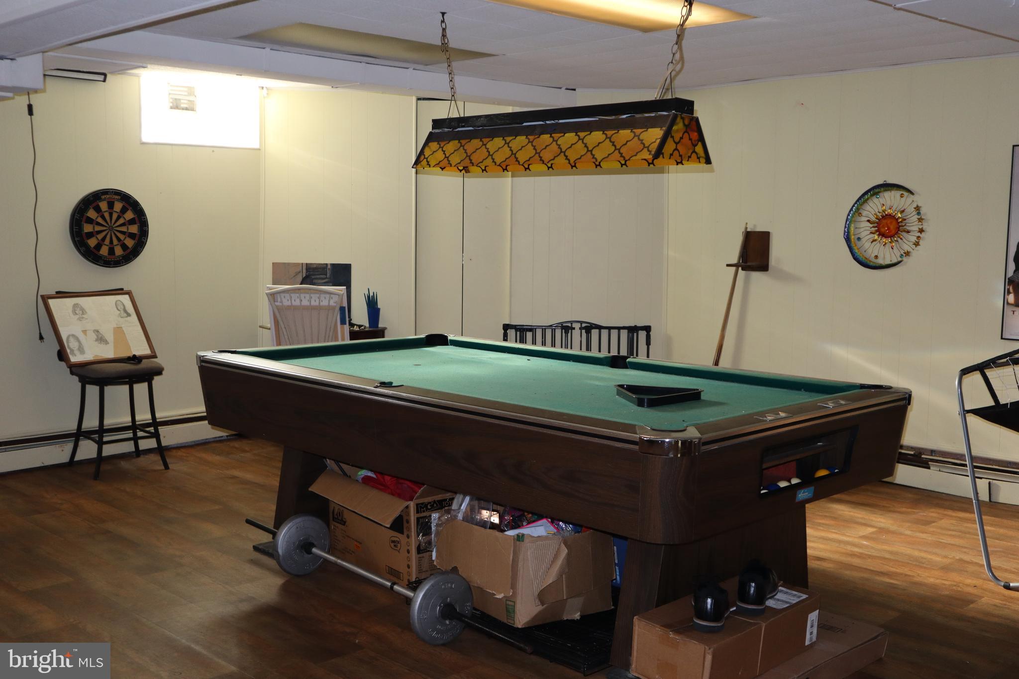 121 Patterson Avenue Bellmawr, NJ 08031 - Photo 18 of 20 a room with gym equipment and a table