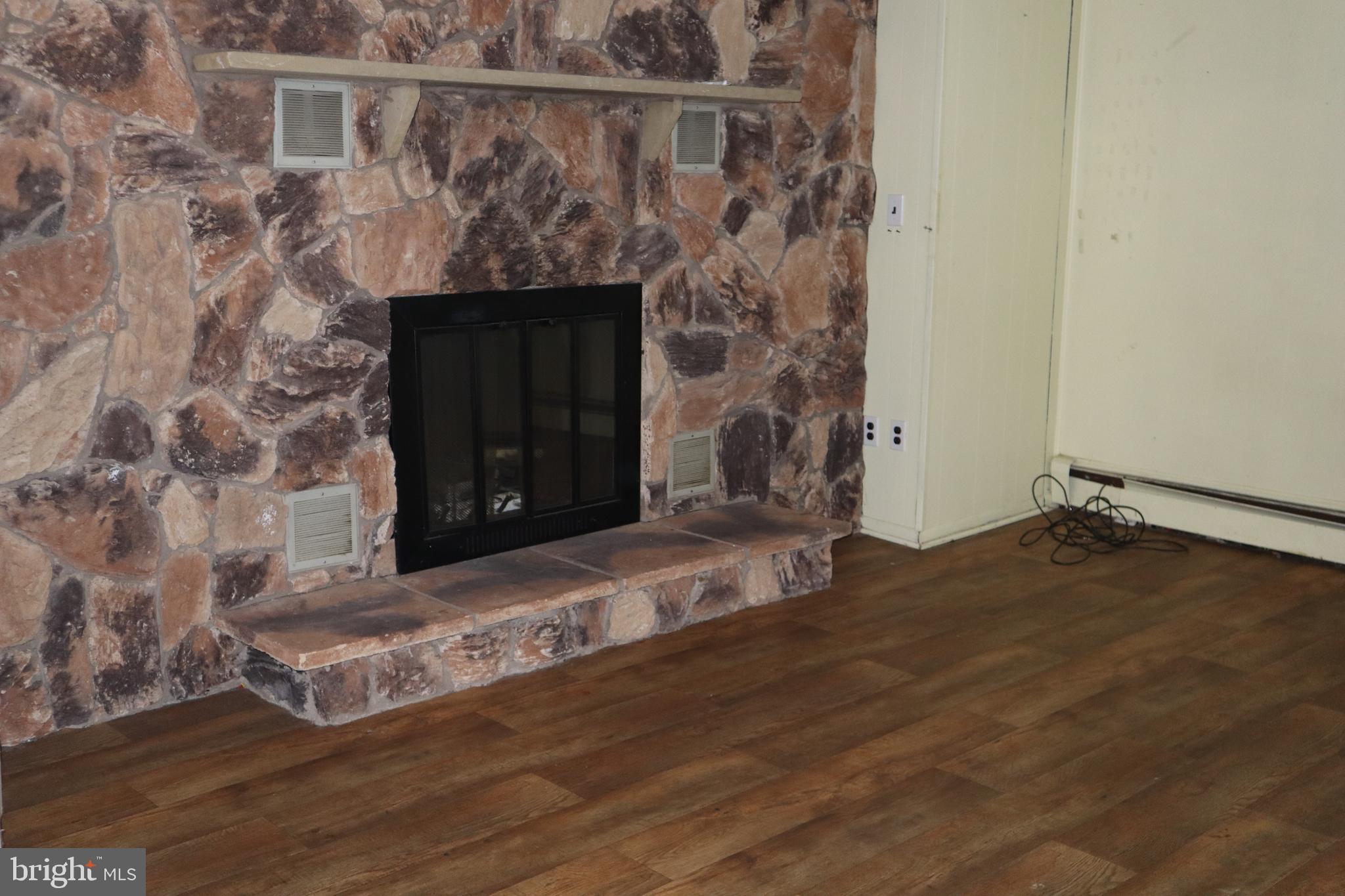 121 Patterson Avenue Bellmawr, NJ 08031 - Photo 19 of 20 a living room with a fireplace