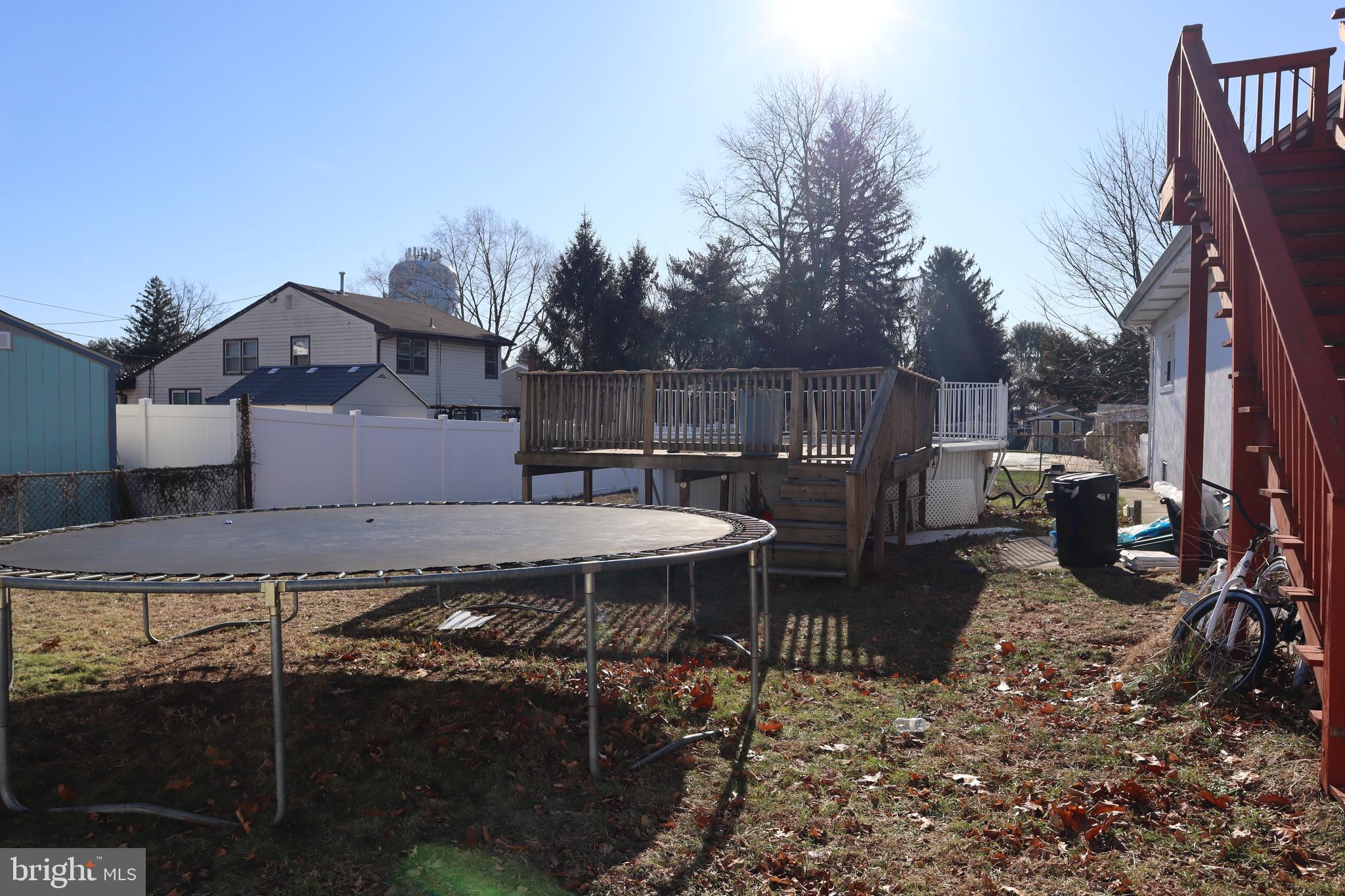 121 Patterson Avenue Bellmawr, NJ 08031 - Photo 20 of 20 a view of a patio with table and chairs a barbeque with wooden fence