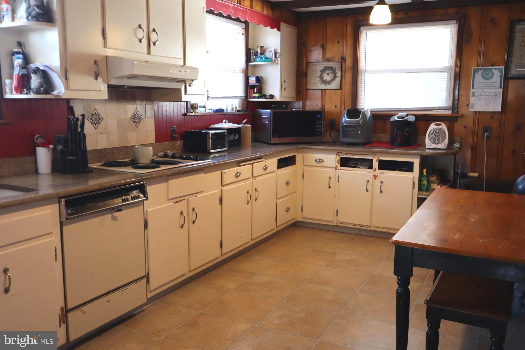 121 Patterson Avenue Bellmawr, NJ 08031 - Photo 6 of 20 a kitchen with a sink cabinets and window