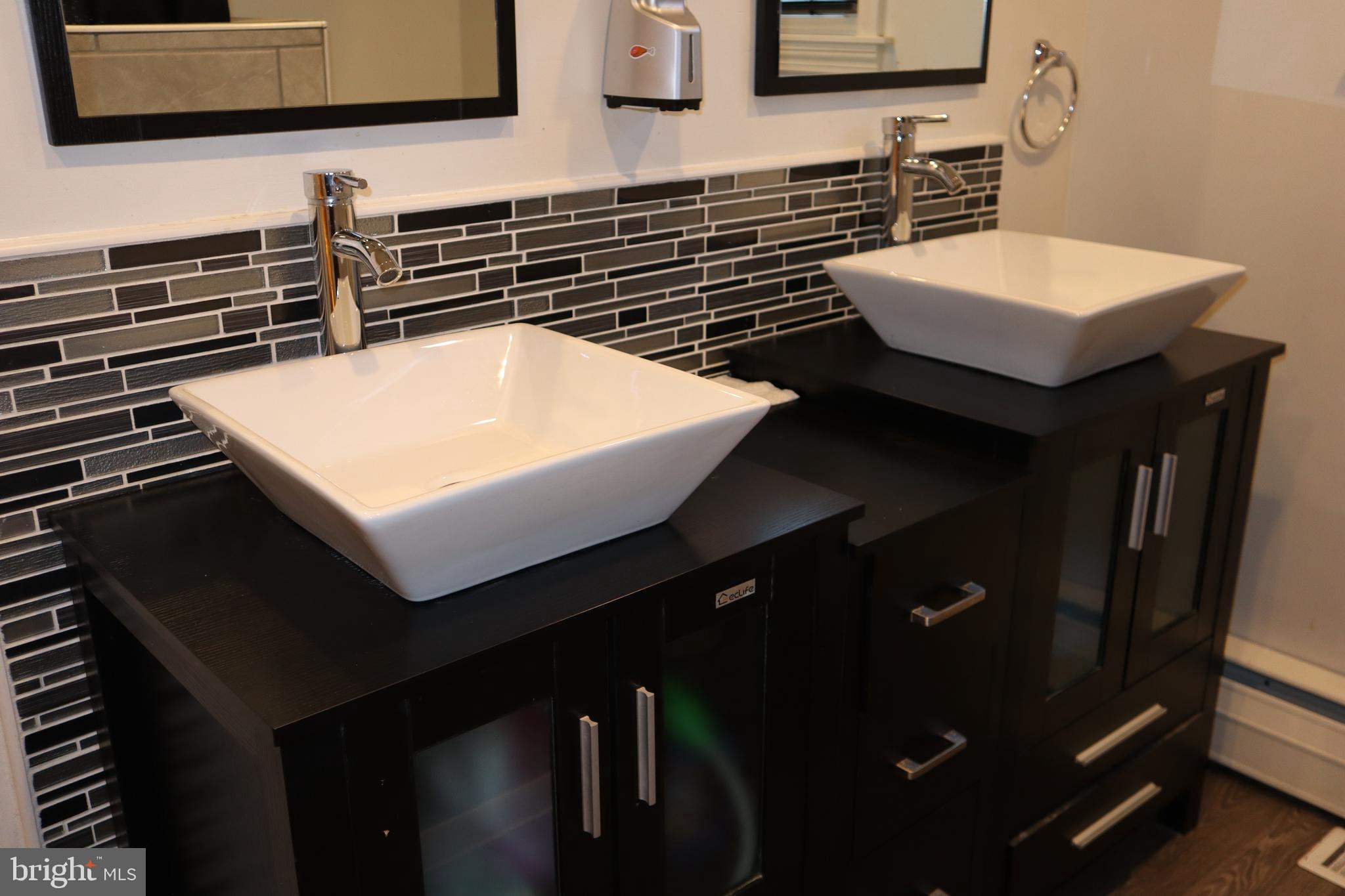 121 Patterson Avenue Bellmawr, NJ 08031 - Photo 10 of 20 a bathroom with a sink and a mirror