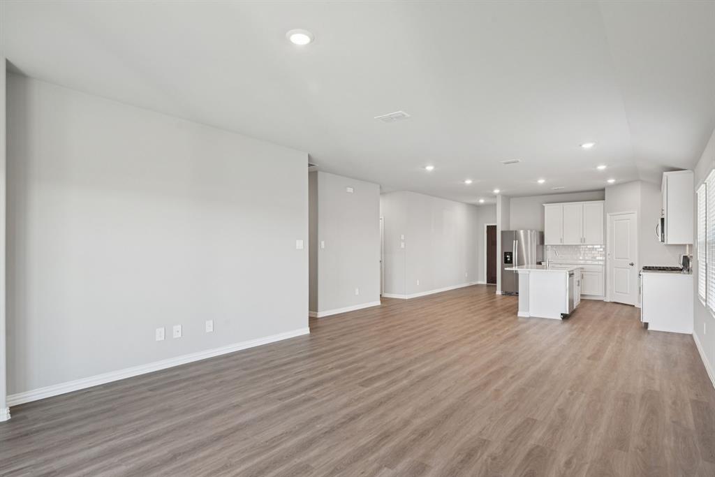2112 Rannoch Street Sherman, TX 75092 - Photo 12 of 32 a view of an empty room with wooden floor
