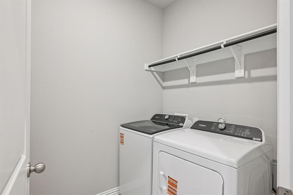2112 Rannoch Street Sherman, TX 75092 - Photo 17 of 32 a utility room with dryer and washer