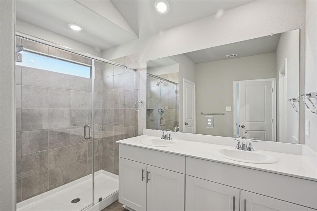 2112 Rannoch Street Sherman, TX 75092 - Photo 29 of 32 a bathroom with double sink and a shower
