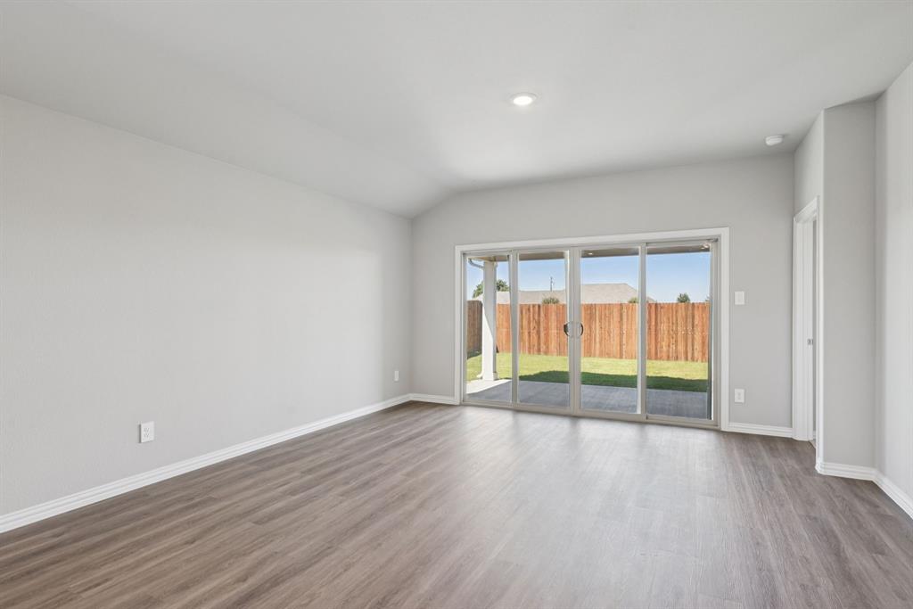 2112 Rannoch Street Sherman, TX 75092 - Photo 8 of 32 wooden floor in an empty room with a window