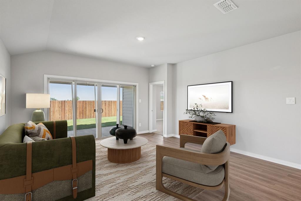 2112 Rannoch Street Sherman, TX 75092 - Photo 10 of 32 a living room with furniture and a flat screen tv