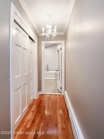 a view of a hallway with a chandelier