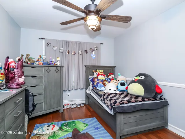 a living room with furniture and flowers