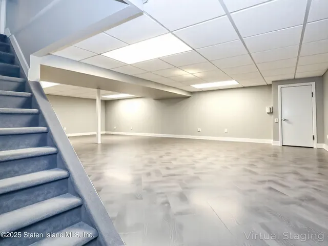 a view of an empty room with stairs