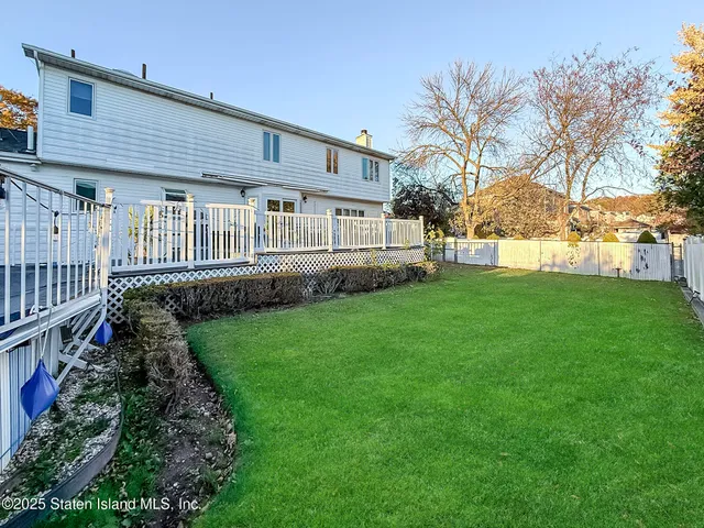 a view of a house with a back yard