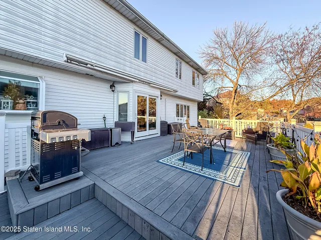 a wooden bench sitting in front of a building