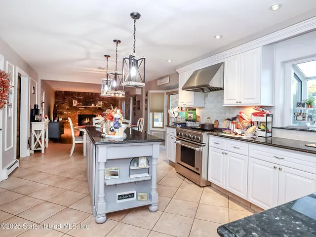 a kitchen with stainless steel appliances granite countertop a sink and cabinets