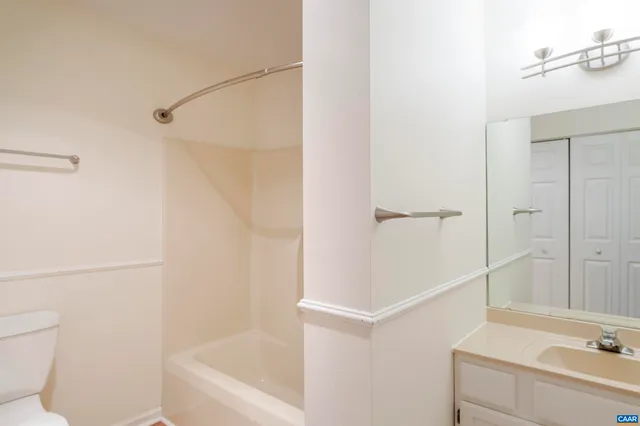 a bathroom with a bathtub and a sink