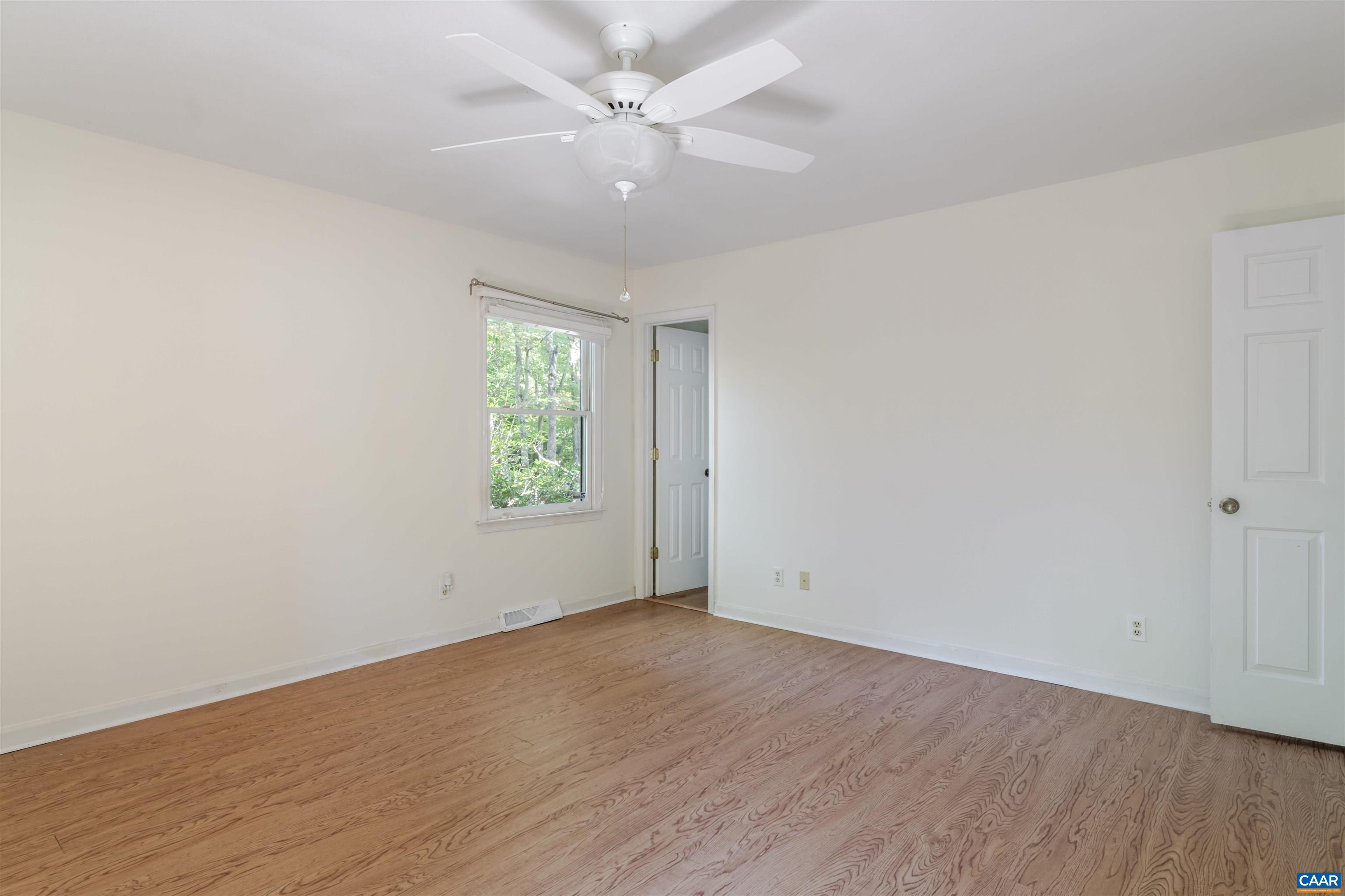 8 Hardwood Road Palmyra, VA 22963 - Photo 17 of 31 wooden floor in an empty room with a window