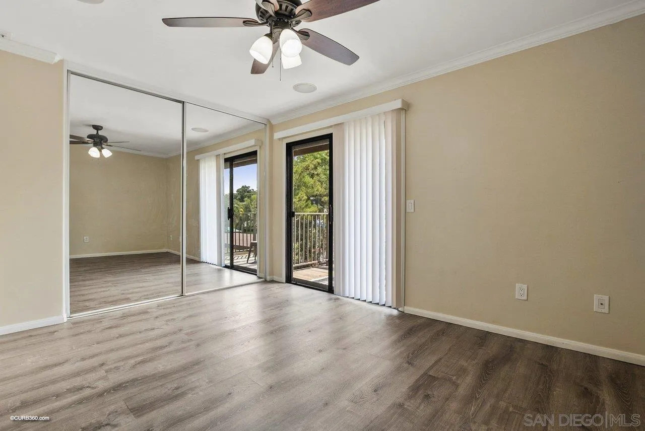 2648 Alpine Boulevard, Unit A Alpine, CA 91901 - Photo 17 of 30 a view of an empty room with wooden floor and a window