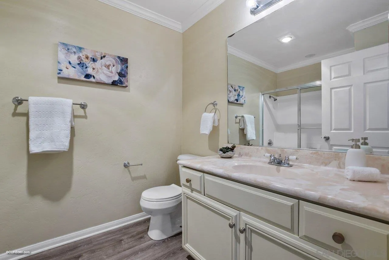 2648 Alpine Boulevard, Unit A Alpine, CA 91901 - Photo 20 of 30 a bathroom with a granite countertop sink mirror vanity and toilet