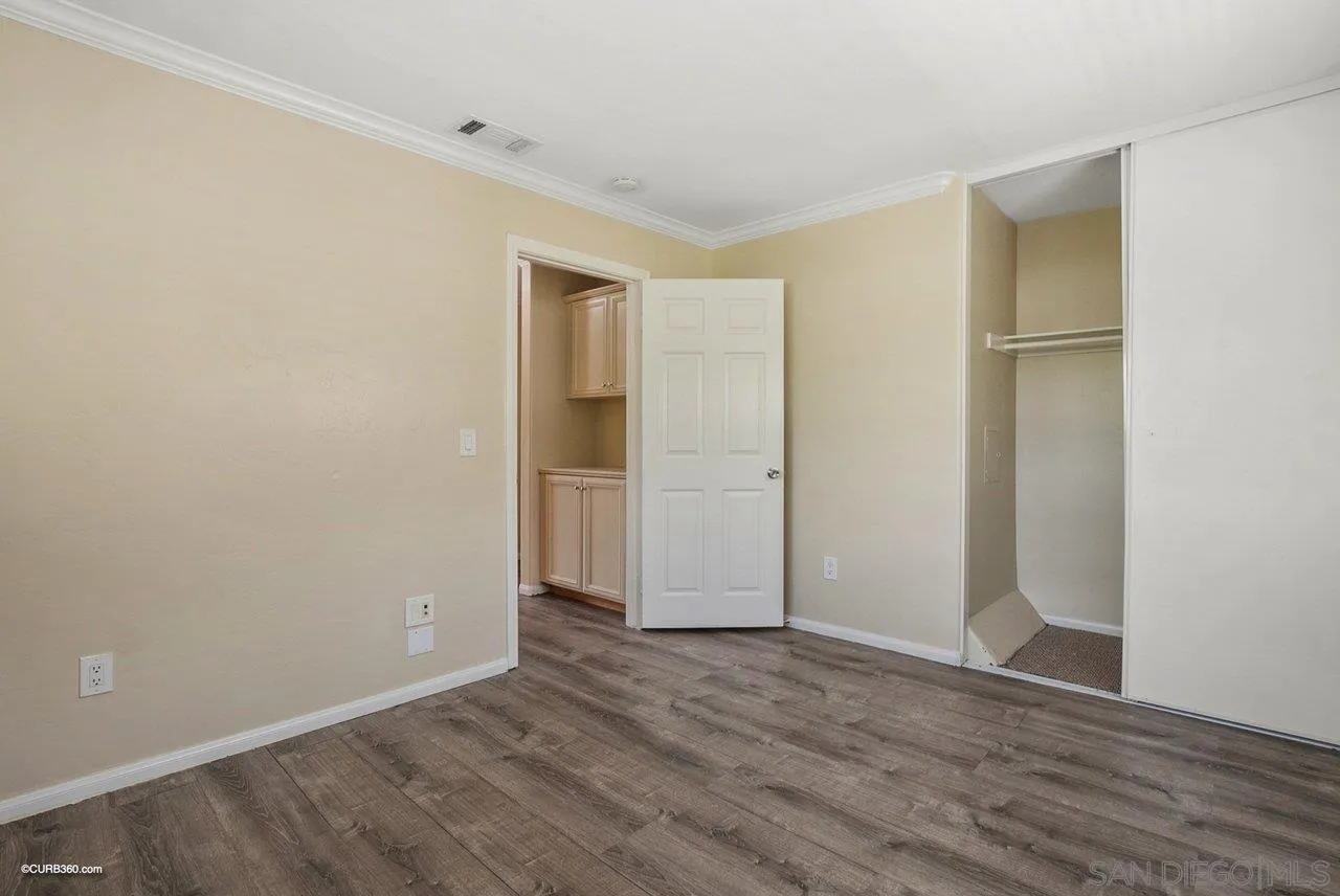2648 Alpine Boulevard, Unit A Alpine, CA 91901 - Photo 22 of 30 a view of an empty room with wooden floor and closet