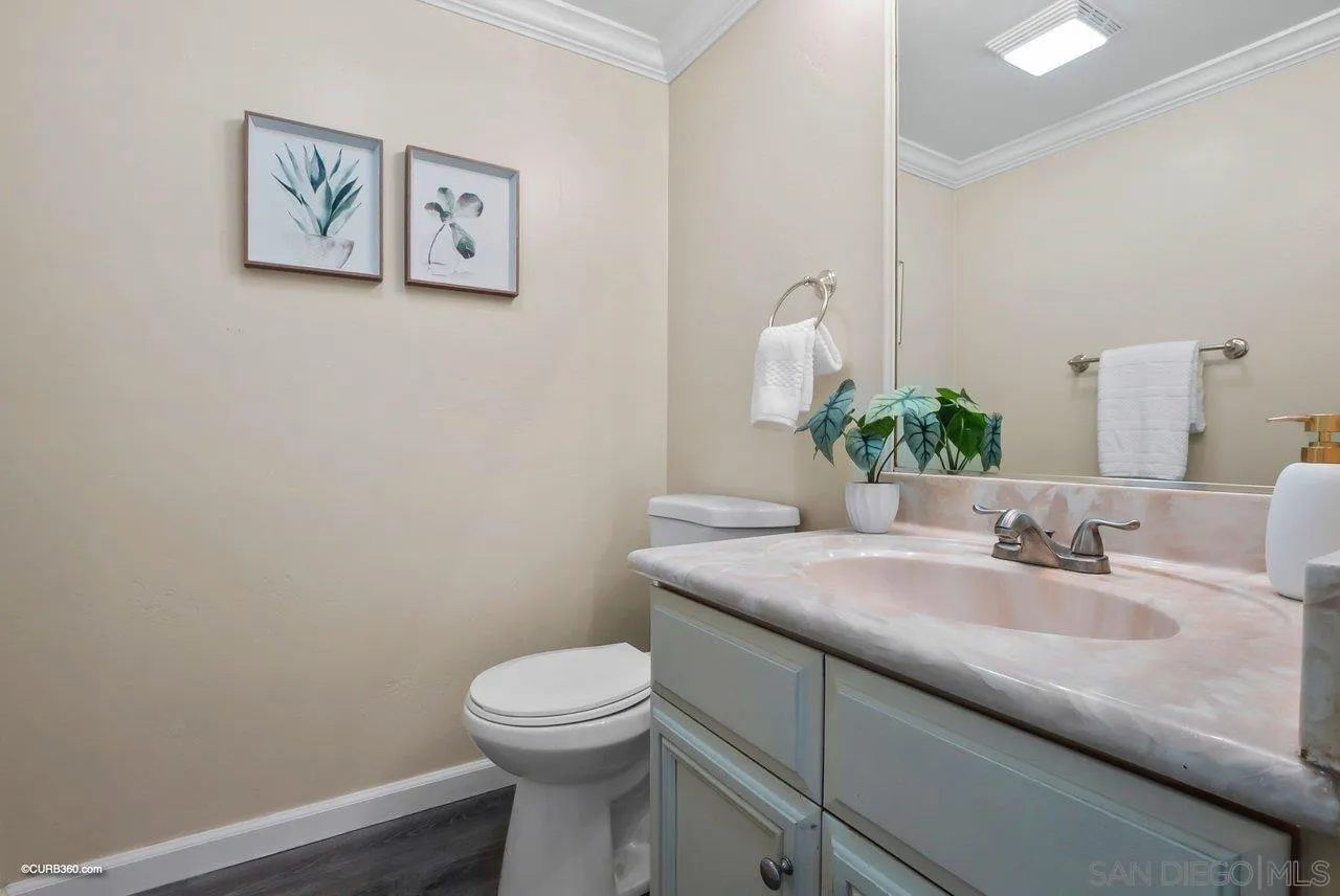 2648 Alpine Boulevard, Unit A Alpine, CA 91901 - Photo 9 of 30 a bathroom with a granite countertop toilet sink and mirror
