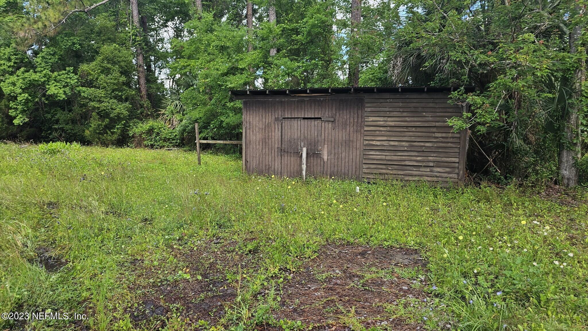 150 Venetian Boulevard St. Augustine, FL 32095 - Photo 12 of 17 a backyard of a house with lots of green space