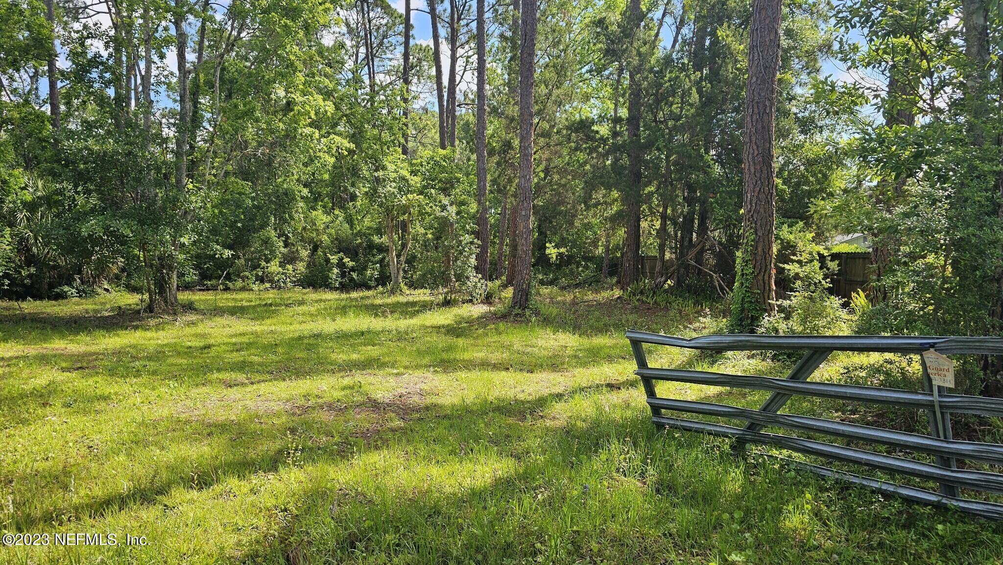 150 Venetian Boulevard St. Augustine, FL 32095 - Photo 14 of 17 a view of a park with large trees