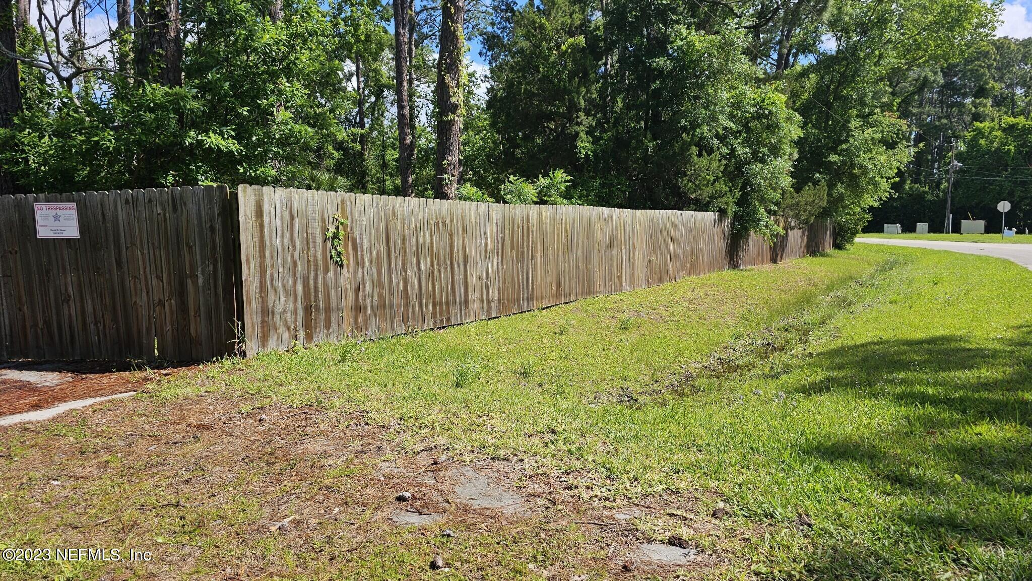 150 Venetian Boulevard St. Augustine, FL 32095 - Photo 6 of 17 a view of backyard with tree